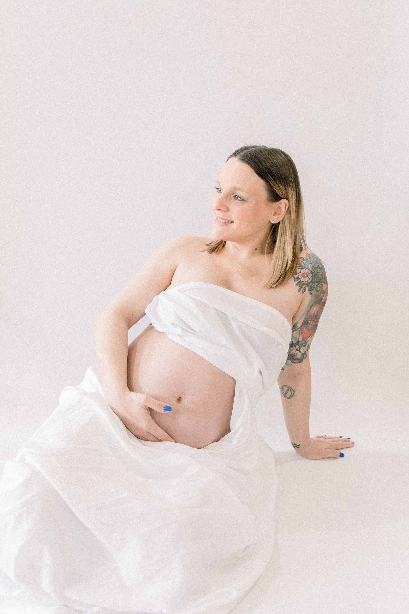 Studio portrait of a pregnant mother. Ottawa Maternity Photographer, Montreal Maternity Photographer, Motherhood Photography, Authentic Photography, Light & Airy Photography, Emily VanderBeek Photography.