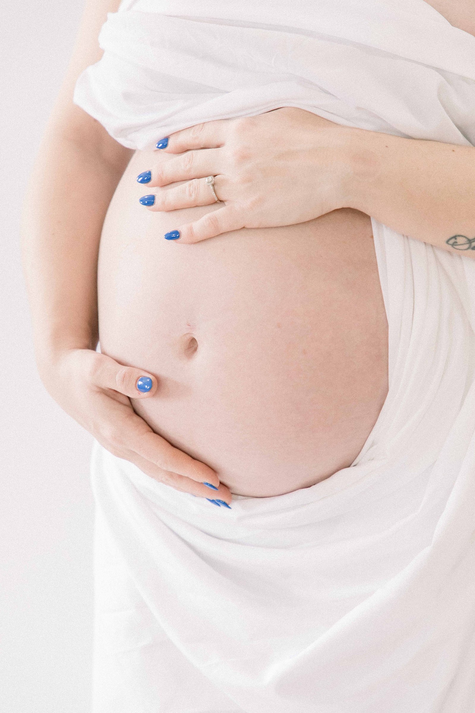Studio portrait of a pregnant mother. Ottawa Maternity Photographer, Montreal Maternity Photographer, Motherhood Photography, Authentic Photography, Light & Airy Photography, Emily VanderBeek Photography.