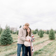 Maternity photo of man hugging woman on Christmas tree farm, Emily VanderBeek Photography, Portrait and Family photography, Niagara Photographer, Champlain Photographer, Vaudreuil-Soulanges Photographer, candid photography, authentic photography.