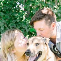 Portrait of man and woman kissing pet dog, Emily VanderBeek Photography, Portrait and Family photography, Niagara Photographer, Champlain Photographer, Vaudreuil-Soulanges Photographer, candid photography, authentic photography.