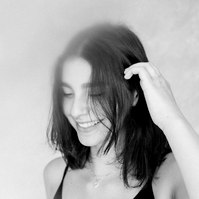 Black and white portrait of a women looking down and smiling, Emily VanderBeek Photography, Portrait and Family photography, Niagara Photographer, Champlain Photographer, Vaudreuil-Soulanges Photographer, candid photography, authentic photography.