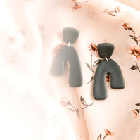 Stylized photo of black handmade earrings on colourful background, Emily VanderBeek Photography, Portrait and Family photography, Niagara Photographer, Champlain Photographer, Vaudreuil-Soulanges Photographer, candid photography, authentic photography.