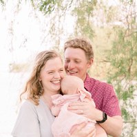 Candid portrait of family of three by the water. Emily VanderBeek Photography, Portrait and Family photography, Niagara Photographer, Champlain Photographer, Vaudreuil-Soulanges Photographer, candid photography, authentic photography.