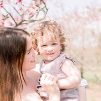 Candid portrait of mother holding baby girl. Emily VanderBeek Photography, Portrait and Family photography, Niagara Photographer, Champlain Photographer, Vaudreuil-Soulanges Photographer, candid photography, authentic photography.