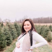 Maternity photo of woman standing on Christmas tree farm, Emily VanderBeek Photography, Portrait and Family photography, Niagara Photographer, Champlain Photographer, Vaudreuil-Soulanges Photographer, candid photography, authentic photography.