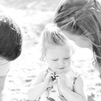 Black and white photo of a family of three on the beach, Emily VanderBeek Photography, Portrait and Family photography, Niagara Photographer, Champlain Photographer, Vaudreuil-Soulanges Photographer, candid photography, authentic photography.