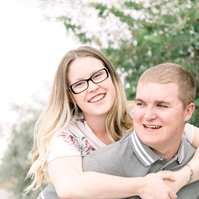 Candid portrait of man giving woman a piggy back on the beach, Emily VanderBeek Photography, Portrait and Family photography, Niagara Photographer, Champlain Photographer, Vaudreuil-Soulanges Photographer, candid photography, authentic photography.