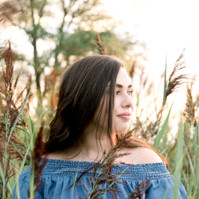 Portrait of woman looking away from camera standing in tall grass, Emily VanderBeek Photography, Portrait and Family photography, Niagara Photographer, Champlain Photographer, Vaudreuil-Soulanges Photographer, candid photography, authentic photography.