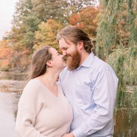 Maternity photo of couple holding woman's belly and touching noses, Emily VanderBeek Photography, Portrait and Family photography, Niagara Photographer, Champlain Photographer, Vaudreuil-Soulanges Photographer, candid photography, authentic photography.