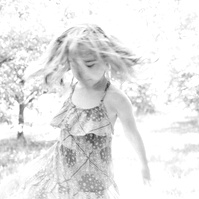 Candid portrait of little girl twirling around an orchard, Emily VanderBeek Photography, Portrait and Family photography, Niagara Photographer, Champlain Photographer, Vaudreuil-Soulanges Photographer, candid photography, authentic photography.