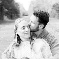 Black and white portrait of husband kissing wife on the cheek. Emily VanderBeek Photography, Portrait and Family photography, Niagara Photographer, Champlain Photographer, Vaudreuil-Soulanges Photographer, candid photography, authentic photography.