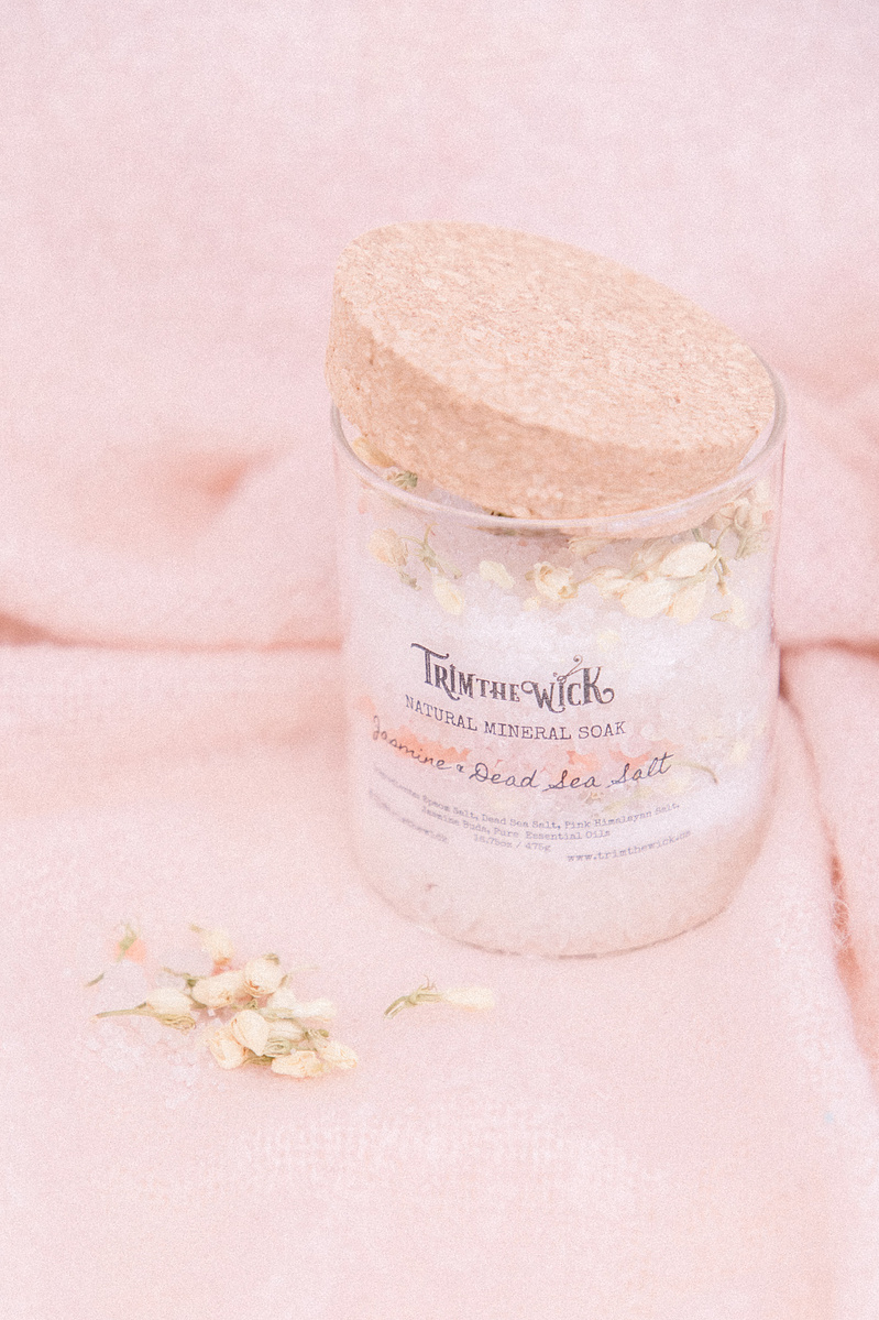 Stylized product photo of bath salts on a pink background, Emily VanderBeek Photography, Portrait and Family photography, Niagara Photographer, Champlain Photographer, Vaudreuil-Soulanges Photographer, candid photography, authentic photography.