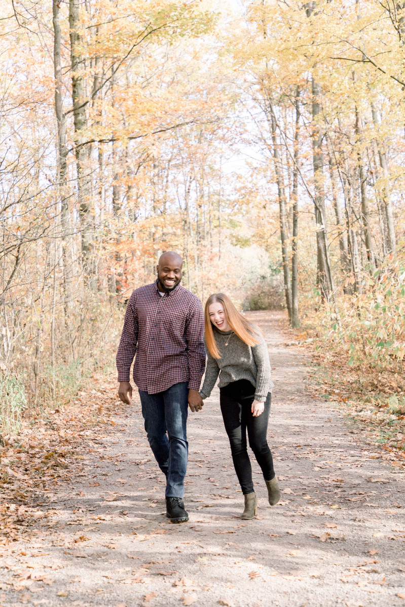 Candid portrait of couple walking fall trail laughing, Emily VanderBeek Photography, Portrait and Family photography, Niagara Photographer, Champlain Photographer, Vaudreuil-Soulanges Photographer, candid photography, authentic photography.