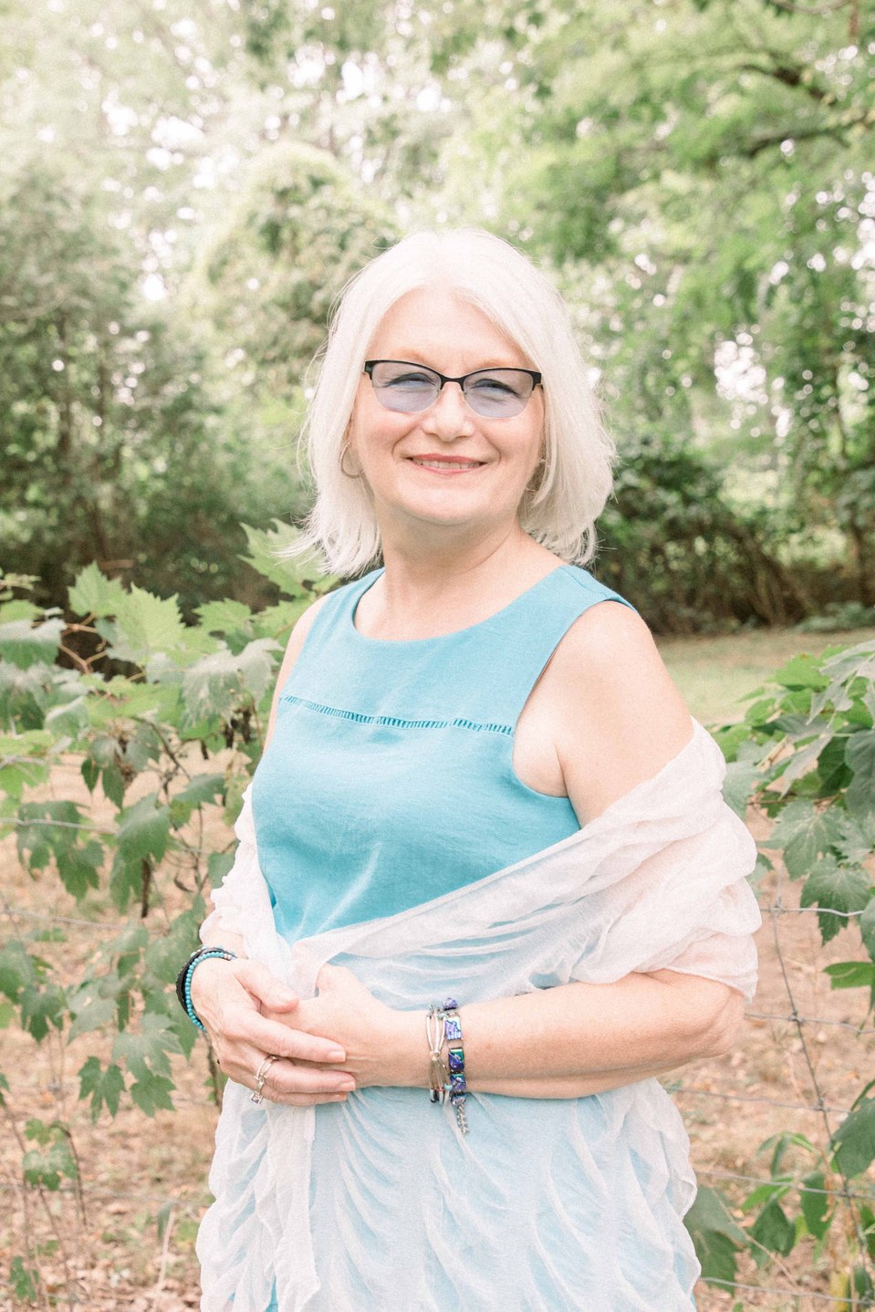 Outdoor portrait of older woman with glasses smiling away from camera, Niagara family photographer, family photography, Niagara portrait photographer, portrait photography, Emily VanderBeek Photography.