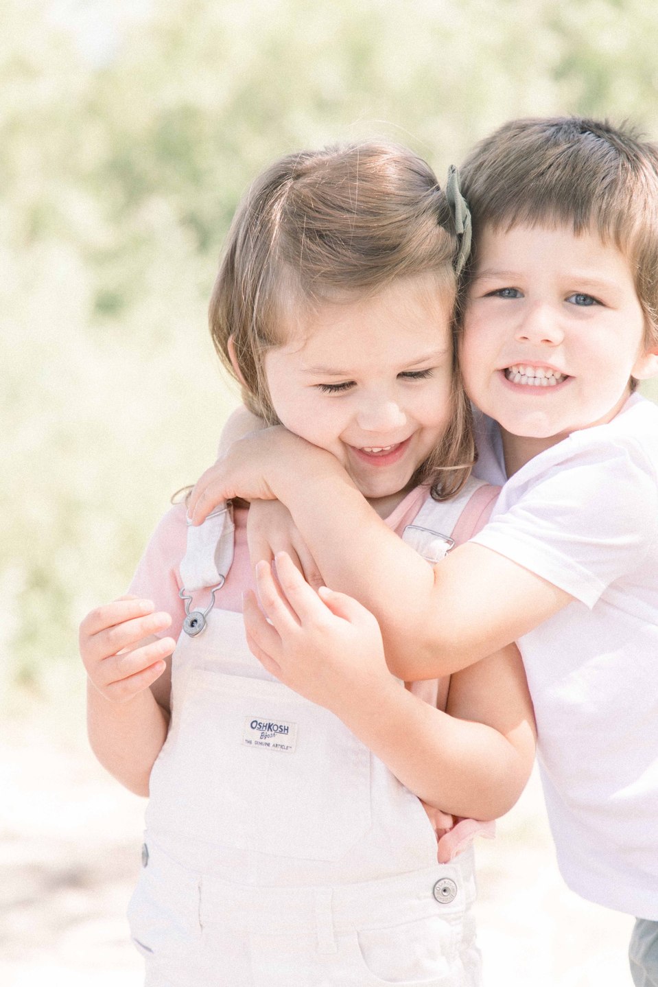 Portrait of siblings hugging each other on the beach, Niagara portrait photographer, Niagara family photographer, portrait photography, family photography, candid photography, authentic photography, Emily VanderBeek Photography.