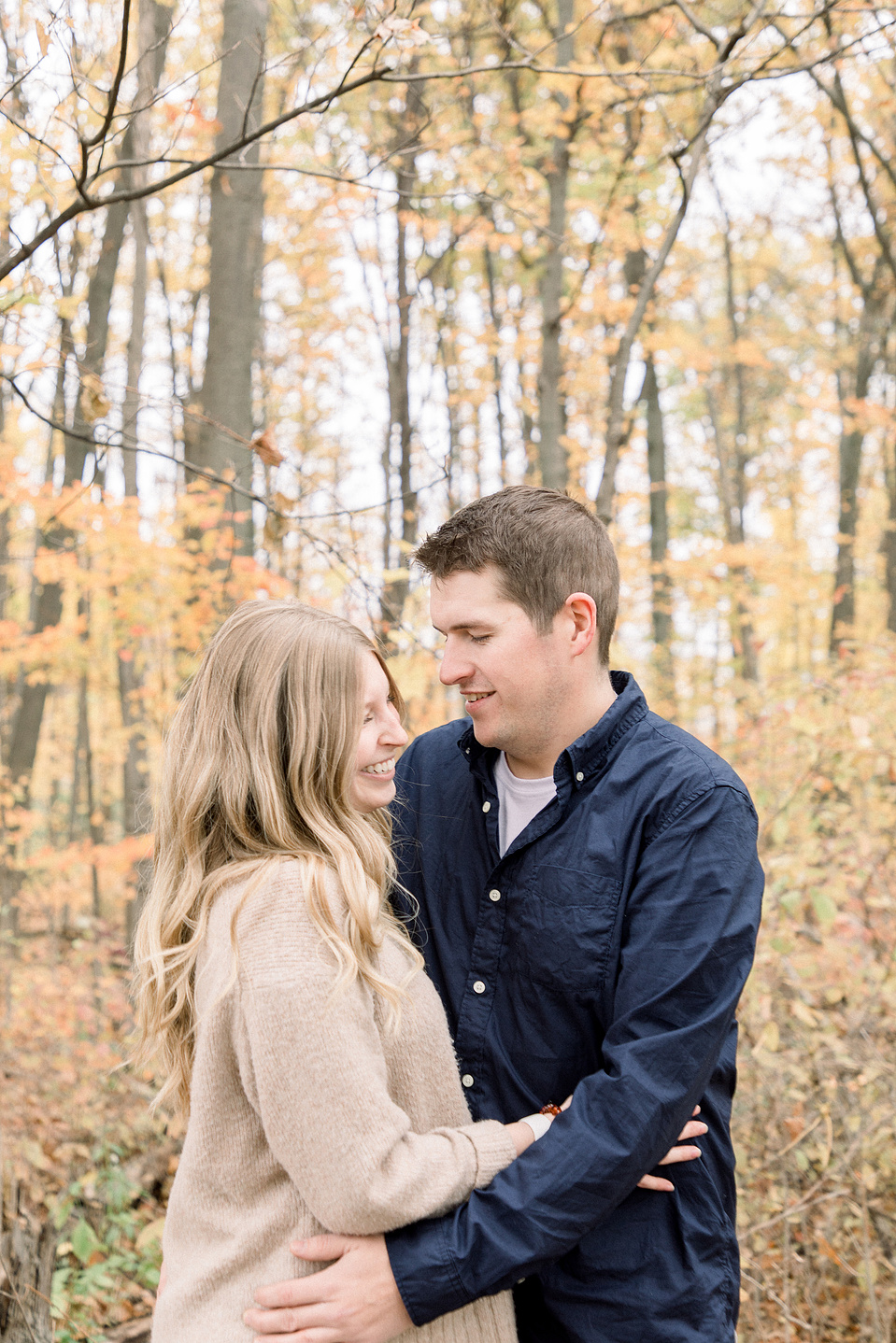 Portrait of couple hugging each other and looking at each other, smiling. Niagara portrait photography, Niagara portrait photographer, Niagara family photography, Niagara family photographer.