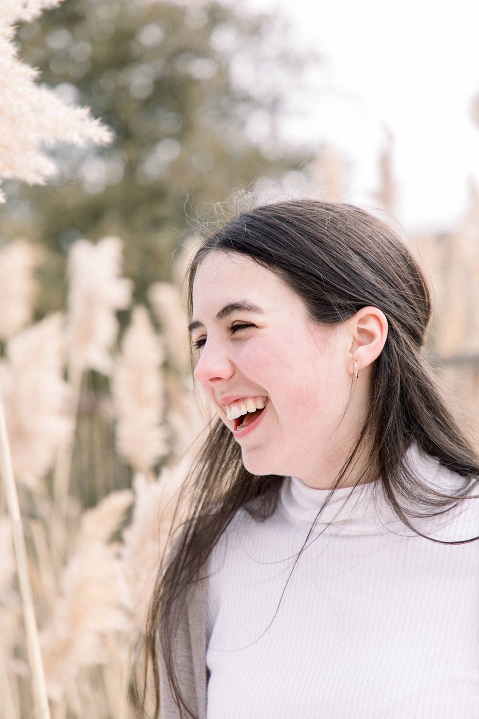 Candid portrait of girl smiling away from the camera, Niagara family photographer, family photography, Niagara portrait photographer, portrait photography, Emily VanderBeek Photography.