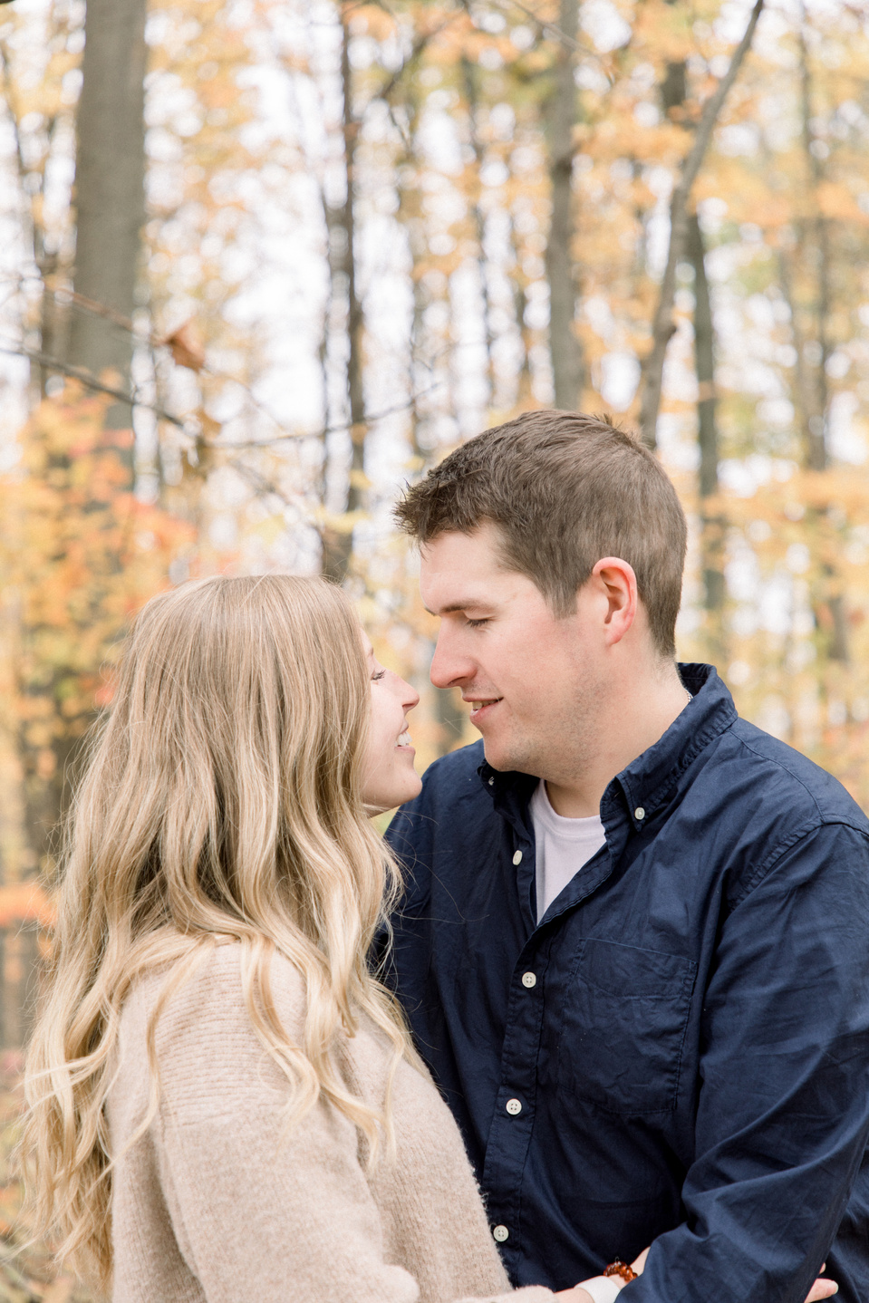 Portrait of couple hugging each other and looking at each other, smiling. Niagara portrait photography, Niagara portrait photographer, Niagara family photography, Niagara family photographer.