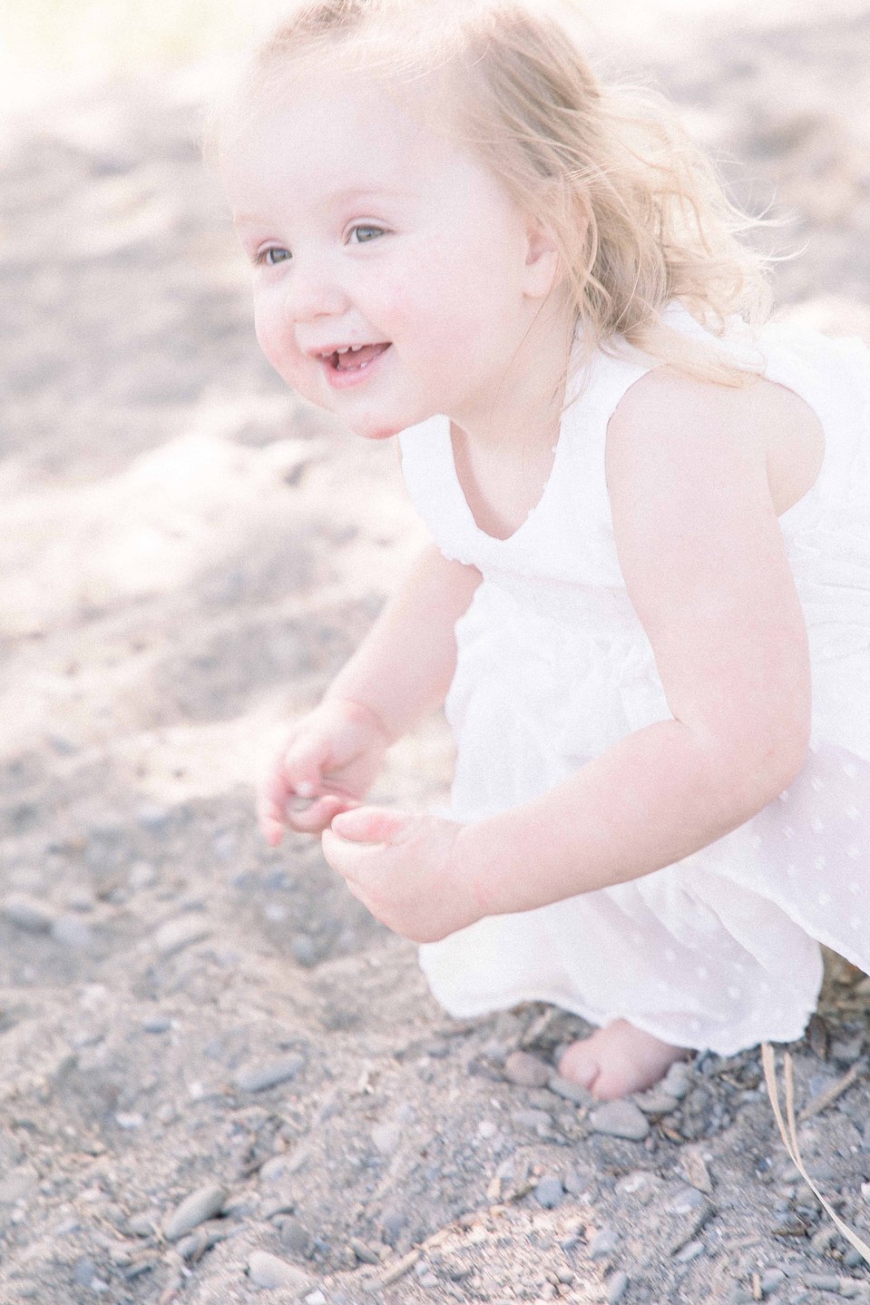 Portrait of little girl playing in the sand on the beach, Niagara portrait photographer, Niagara family photographer, portrait photography, family photography, candid photography, authentic photography, Emily VanderBeek Photography.