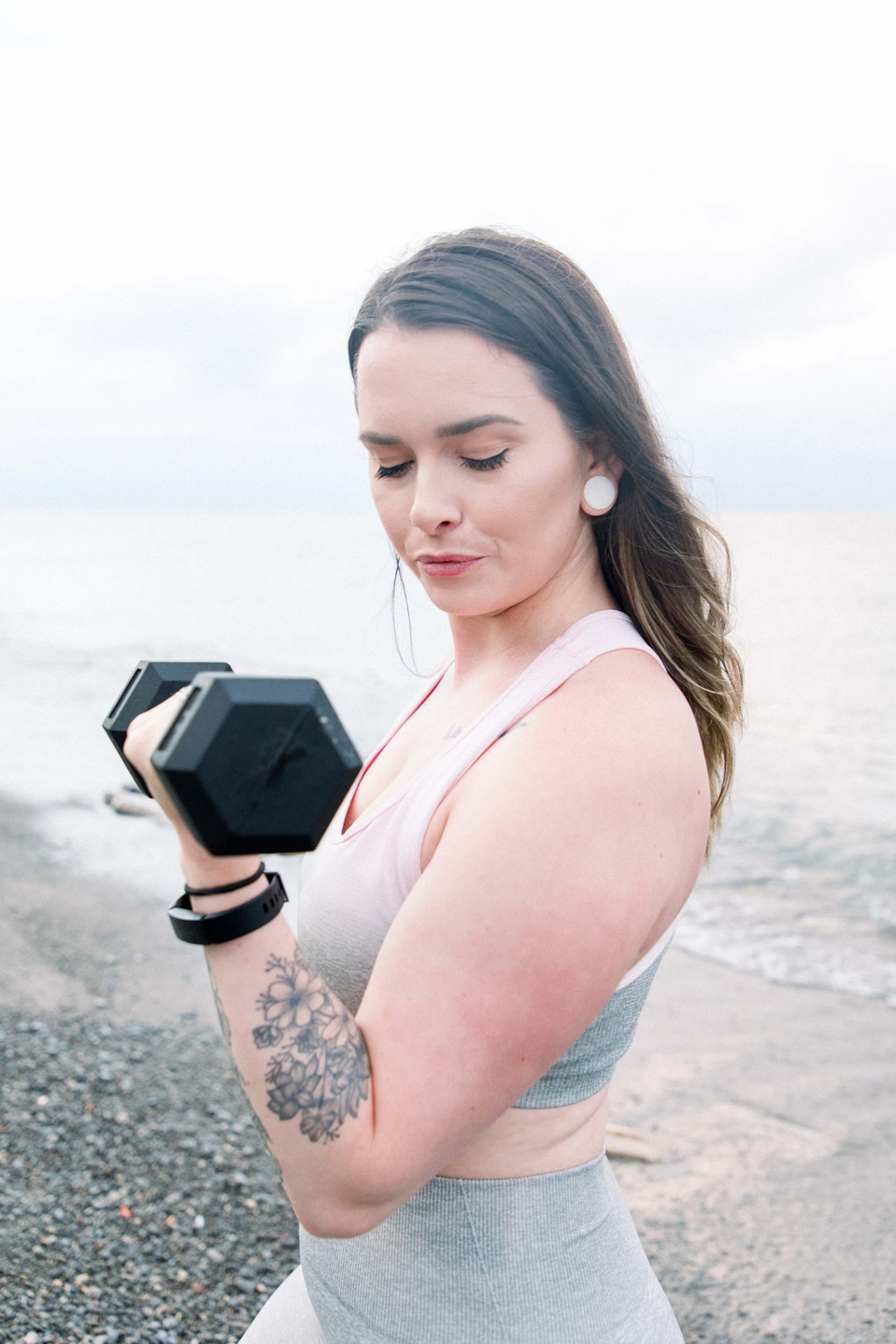 Portrait of a female fitness model lifting a dumbbell, Niagara portrait photographer, Niagara branding photographer