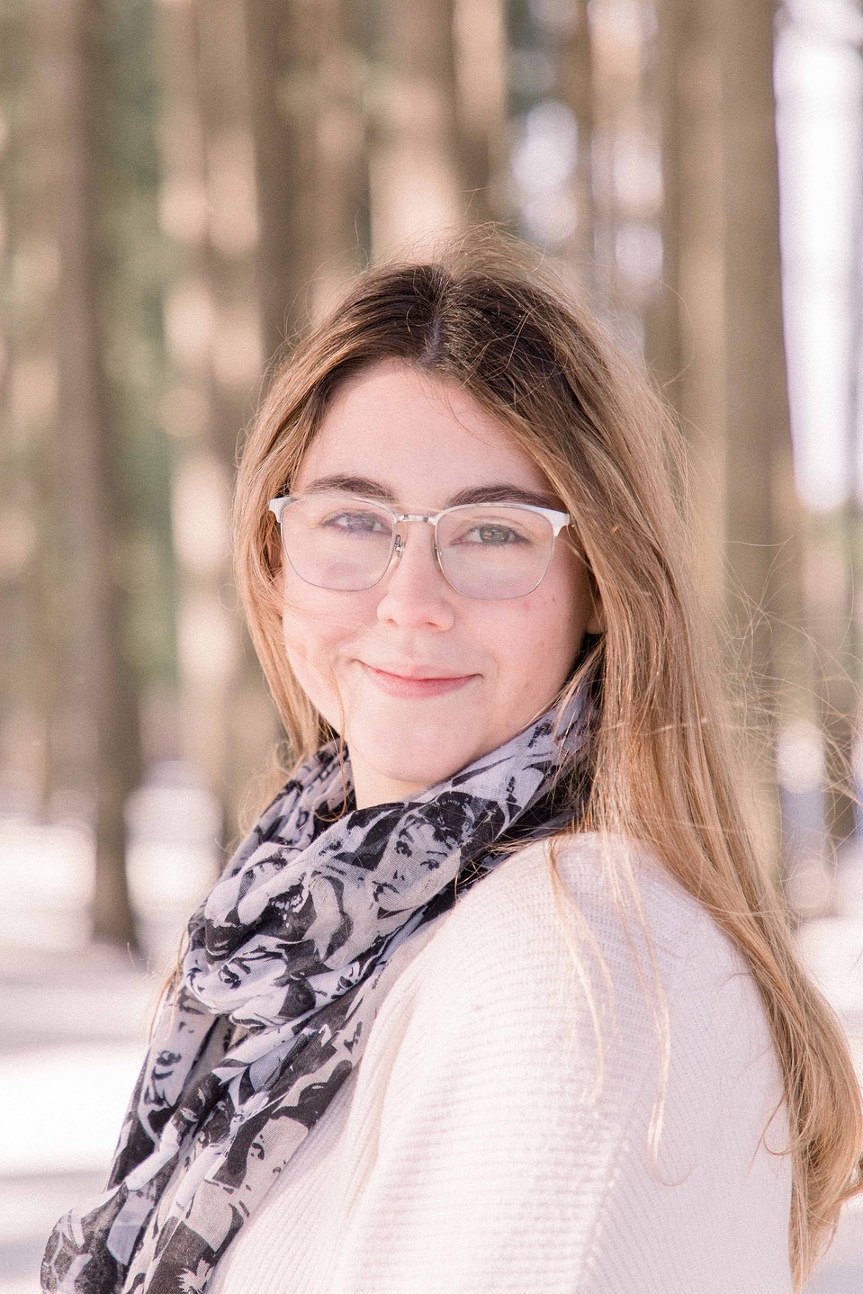 Portrait of a young woman smiling at the camera on a winter trail, Niagara family photographer, family photography, Niagara portrait photographer, portrait photography, Champlain photographer, Hawkesbury photographer, Emily VanderBeek Photography.