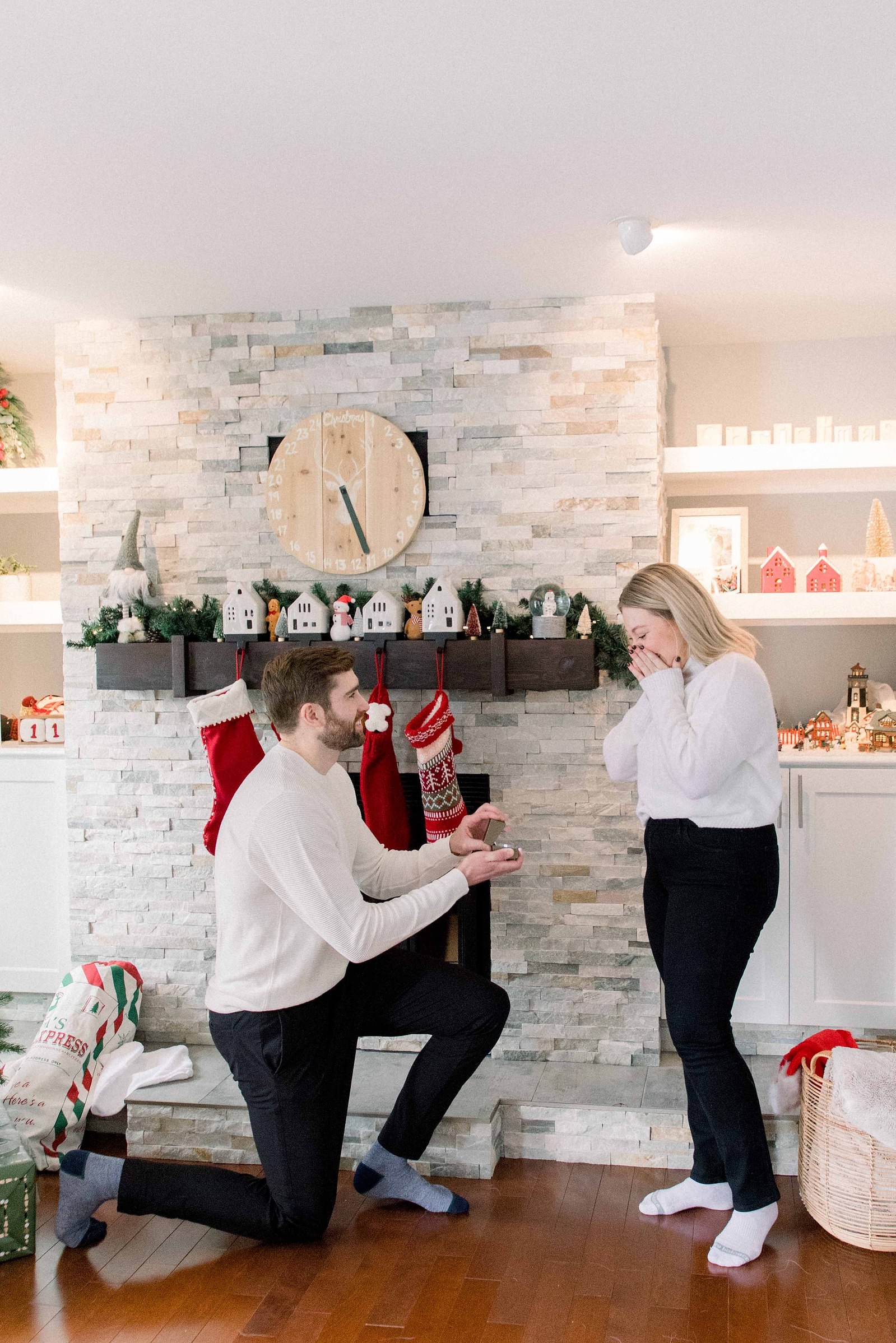 Cozy portrait of male & female couple inside their home. Surprise Proposal. Proposing. Christmas Photos. Ottawa Photographer. Vankleek Hill Photographer. Champlain Photographer. Emily VanderBeek Photography. Candid photography.