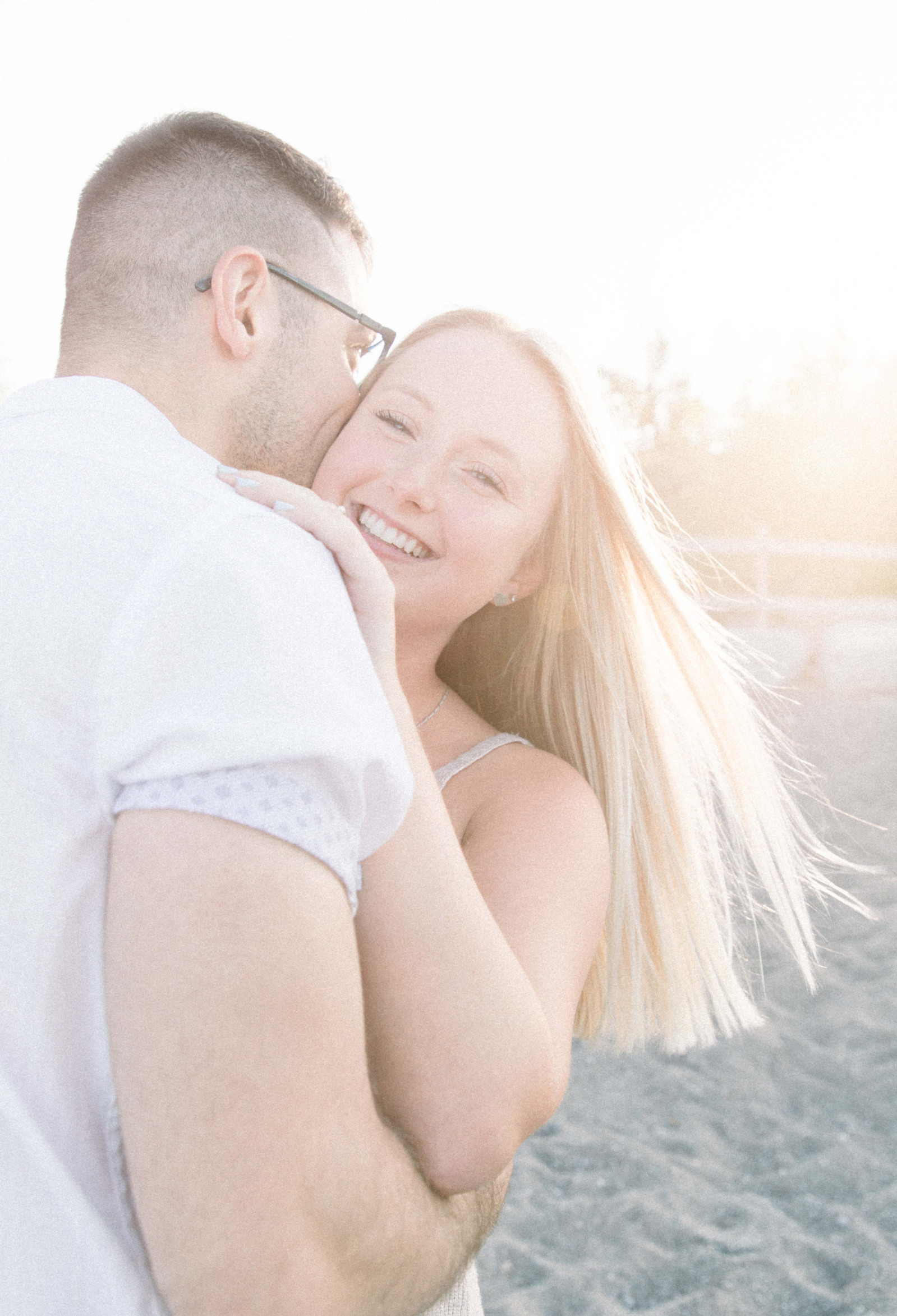 Portrait of couple hugging each other at sunset, Emily VanderBeek Photography, Portrait and Family Photography, Niagara Photographer, Champlain Photographer, Vaudreuil-Soulanges Photographer, candid photography, authentic photography.