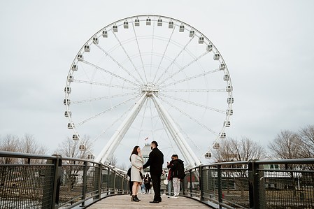 Hana and Nick's Montreal surprise proposal photographer; John KOO Photography; MTL surprise marriage proposal photo; Old Montreal Ferris Wheel surprise proposal; surprise proposal photography Old Montreal