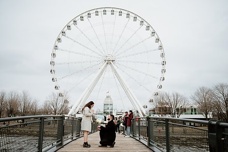 Hana and Nick's Montreal surprise proposal photographer; John KOO Photography; MTL surprise marriage proposal photo; Old Montreal Ferris Wheel surprise proposal; surprise proposal photography Old Montreal