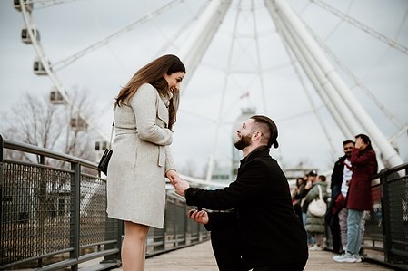 Hana and Nick's Montreal surprise proposal photographer; John KOO Photography; MTL surprise marriage proposal photo; Old Montreal Ferris Wheel surprise proposal; surprise proposal photography Old Montreal