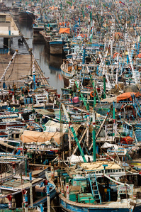 Boats are moored at Karachi Fish Harbor in Pakistan following an alert for Cyclone Vayu, Thursday, June 13, 2019. Cyclone Vayu, now categorized as a tropical cyclone, is likely to stay clear of Pakistan as it moves up along the Indian coastal areas of Guj