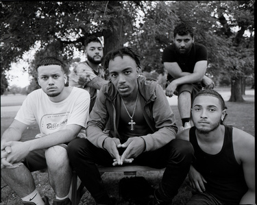 Medium format Black and white group portrait of young Black and Hispanic men at Delaware Park in Buffalo, NY. Photographed on Mamiya RZ67. 