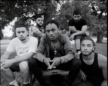 Medium format Black and white group portrait of young Black and Hispanic men at Delaware Park in Buffalo, NY. Photographed on Mamiya RZ67.