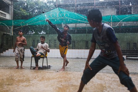 Lyari youth play cricket in torrential rains in Karachi, Pakistan on Tuesday July 30, 2019. The municipal government has released a weather advisory of monsoon rains and thunderstorms that may continue through Friday.