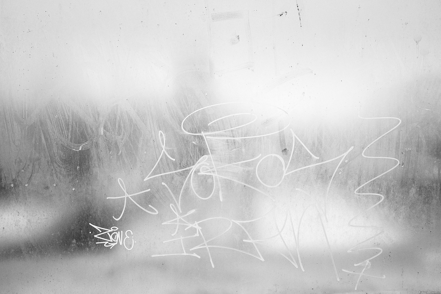 Tags on a frosty window at Käpylä train station, Helsinki