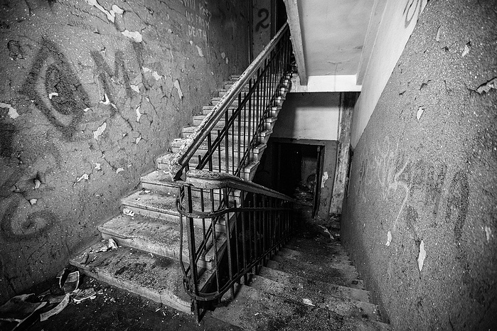 The cold, dark stair case inside an abandoned building in Moscow.