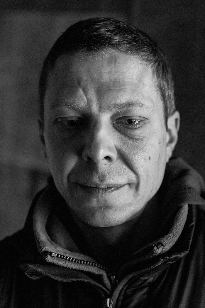 A portrait of a homeless man in an abandoned building in Moscow.