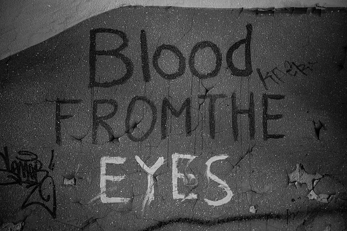 Graffiti on the wall inside an abandoned building in Moscow, it reads "Blood From the Eyes"
