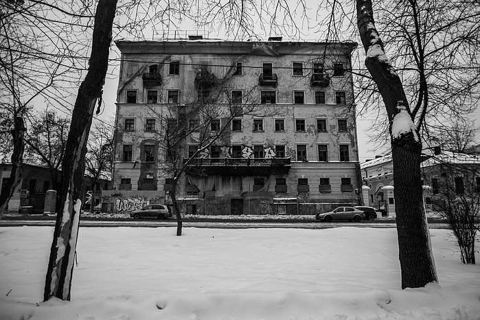 An abandoned building in Moscow. It's winter and snow lays on the ground.