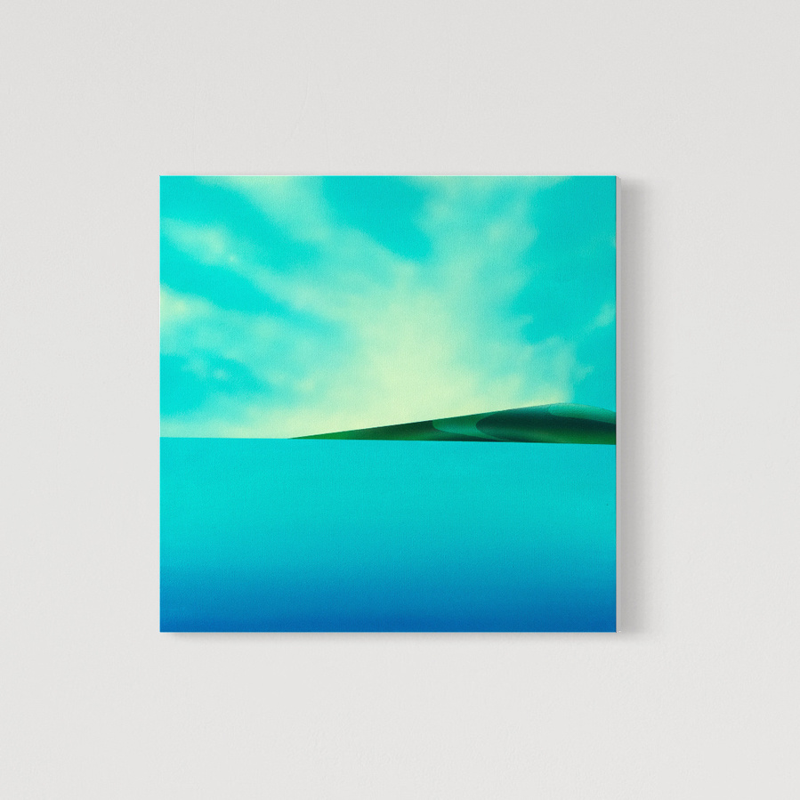 A blue coloured landscape painting.