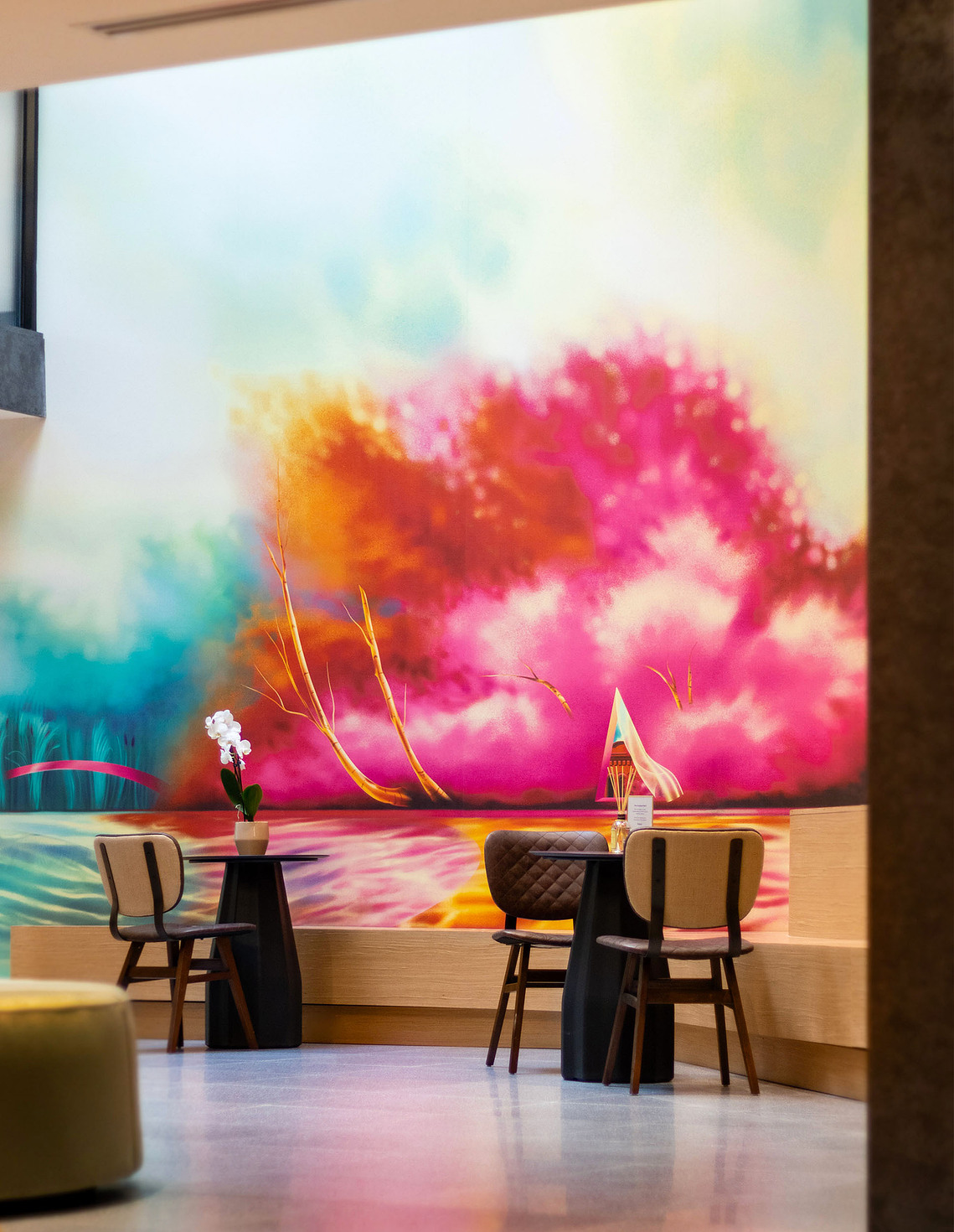 A colourful and bright mural artwork in a condo lobby.