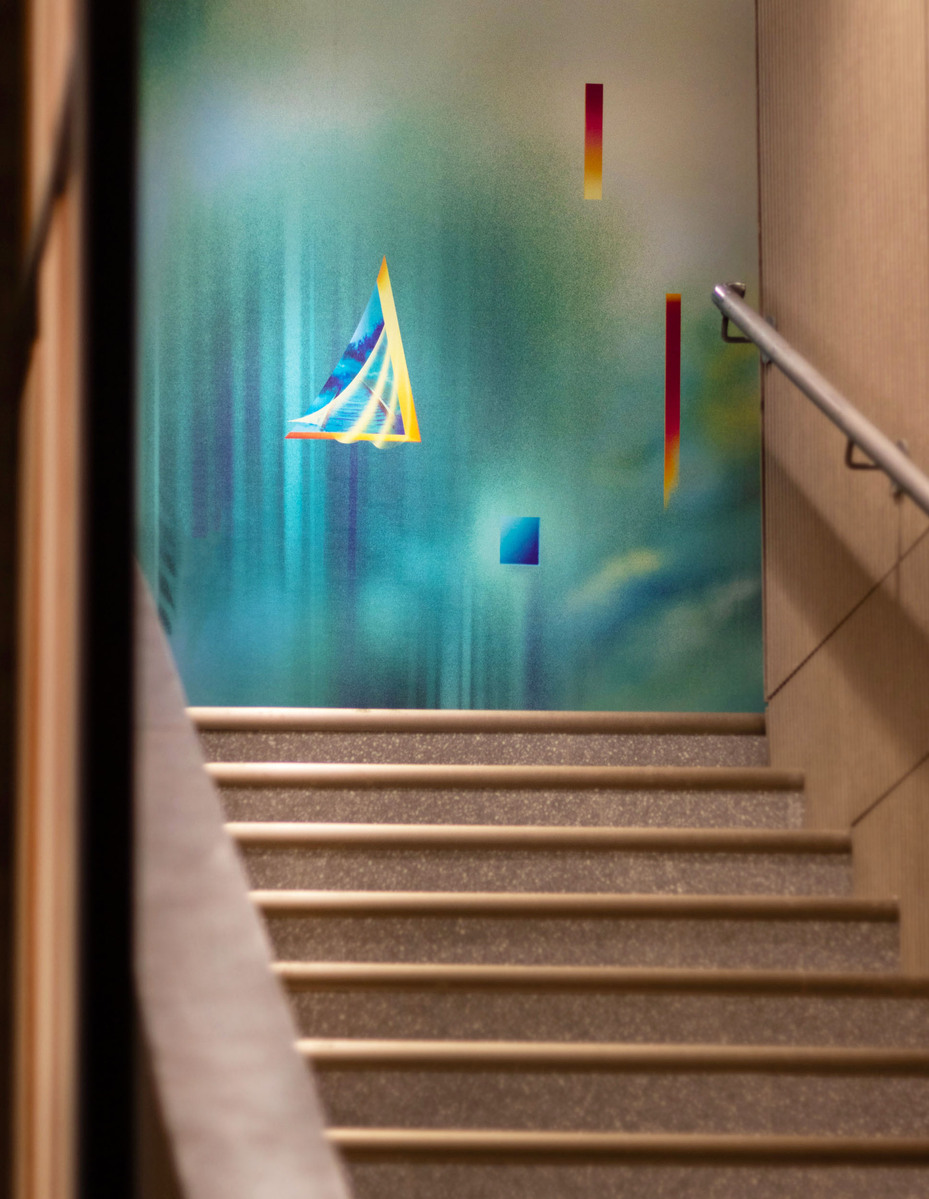 A colourful and bright mural artwork in a condo lobby.
