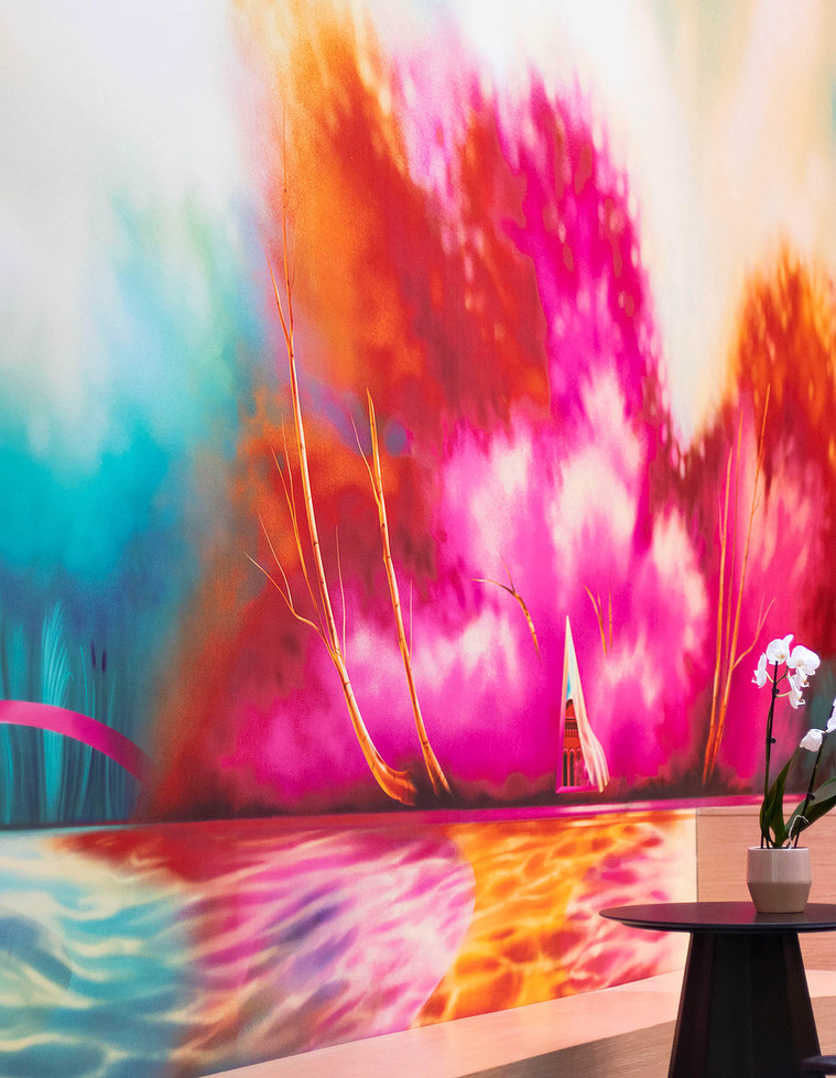 A colourful and bright mural artwork in a condo lobby.