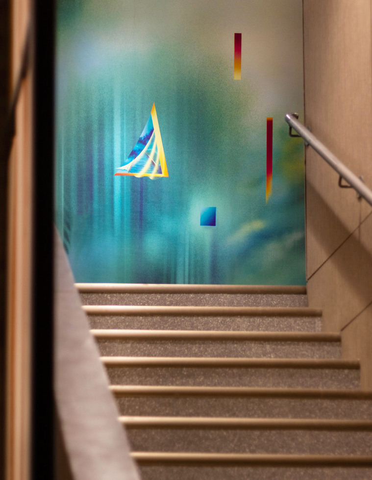 A colourful and bright mural artwork in a condo lobby.