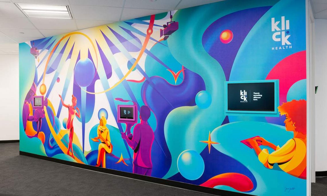 A vibrant, colourful and surreal mural artwork in an office space.
