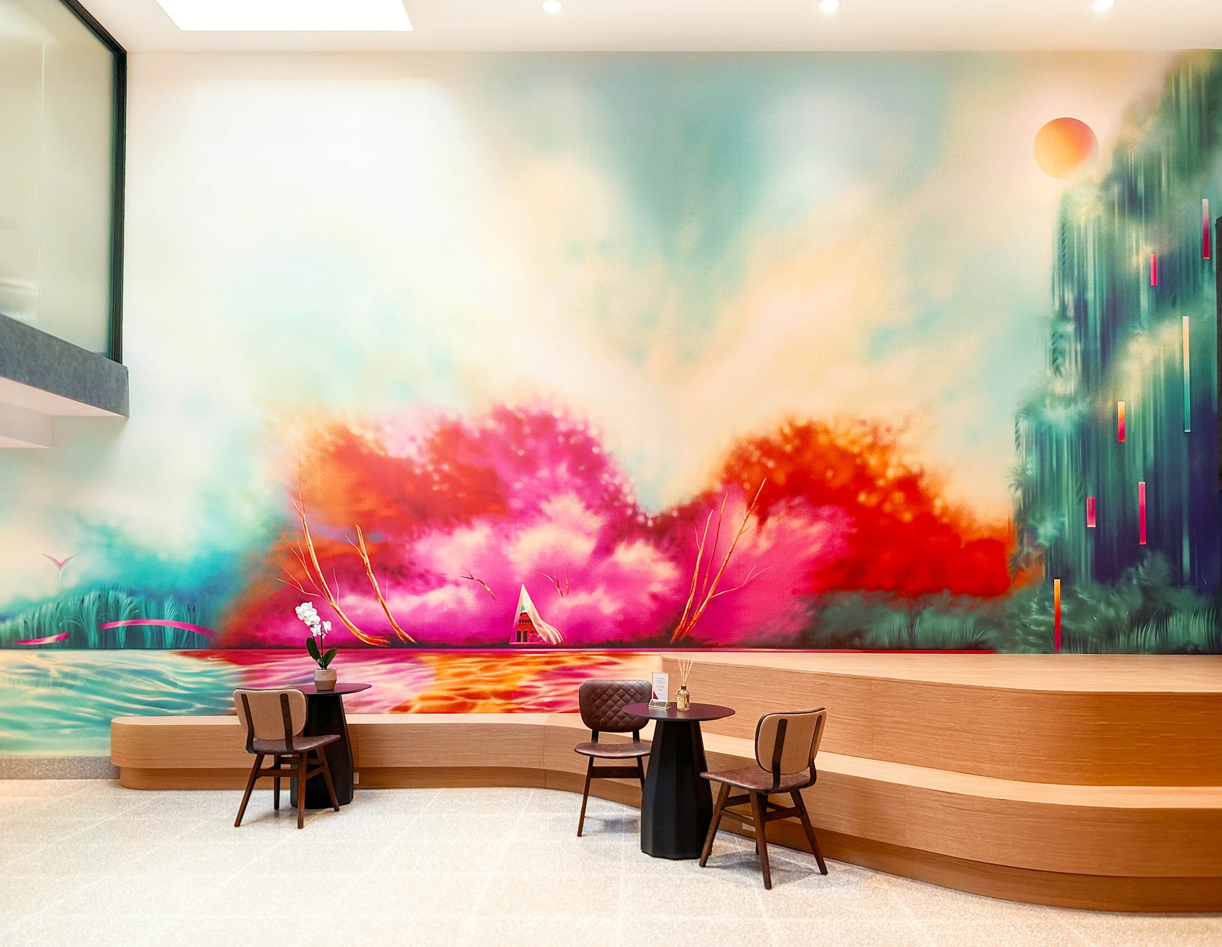 A colourful and bright mural artwork in a condo lobby.
