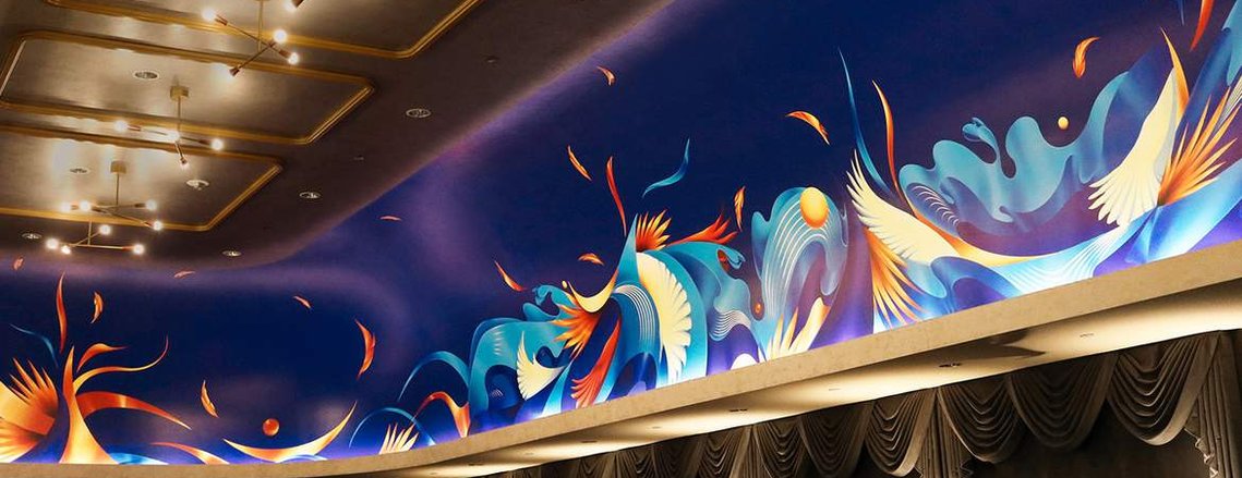 A blue and monochromatic mural in the ceiling wall of a restaurant lounge, depicting the flow of water in a surreal manner.