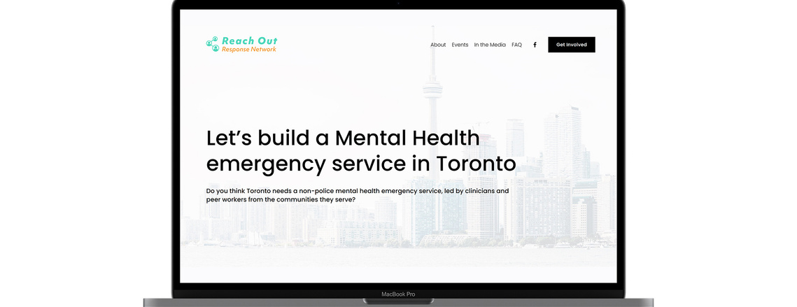 A laptop mockup showing web design for Reach Out Toronto