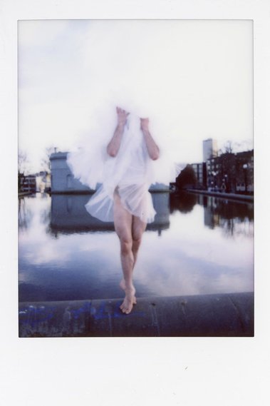 Quinn Hallenbeck dances the Sleeping Beauty; a dancer with tutu in her face, ballerina floating on water.