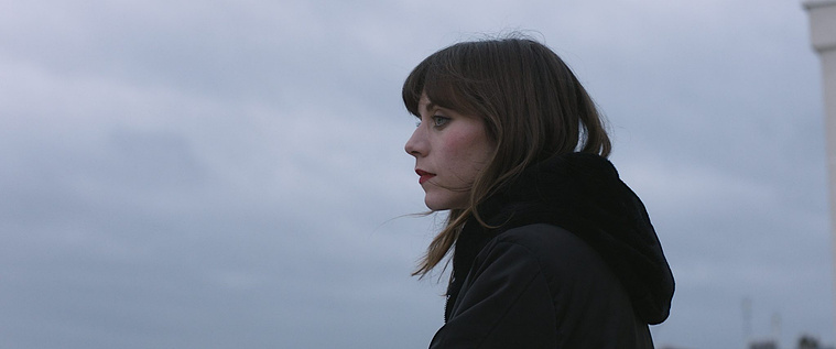 Laure Duedal outside, close-up, grey sky, Alice (2021), dir. Nas Lazreg — cinematography Victor Zyński